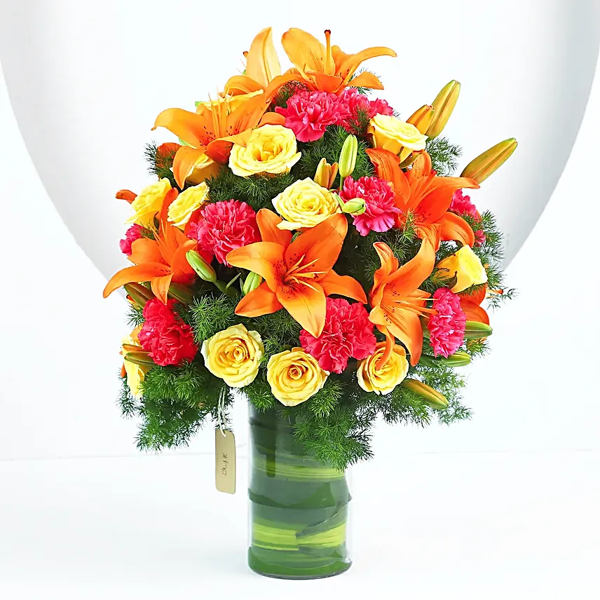 Festive Blaze – Lilies Roses Carnations Vase